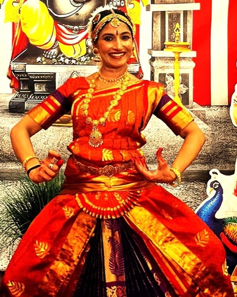 Dancer in red Bharatanatyam costume